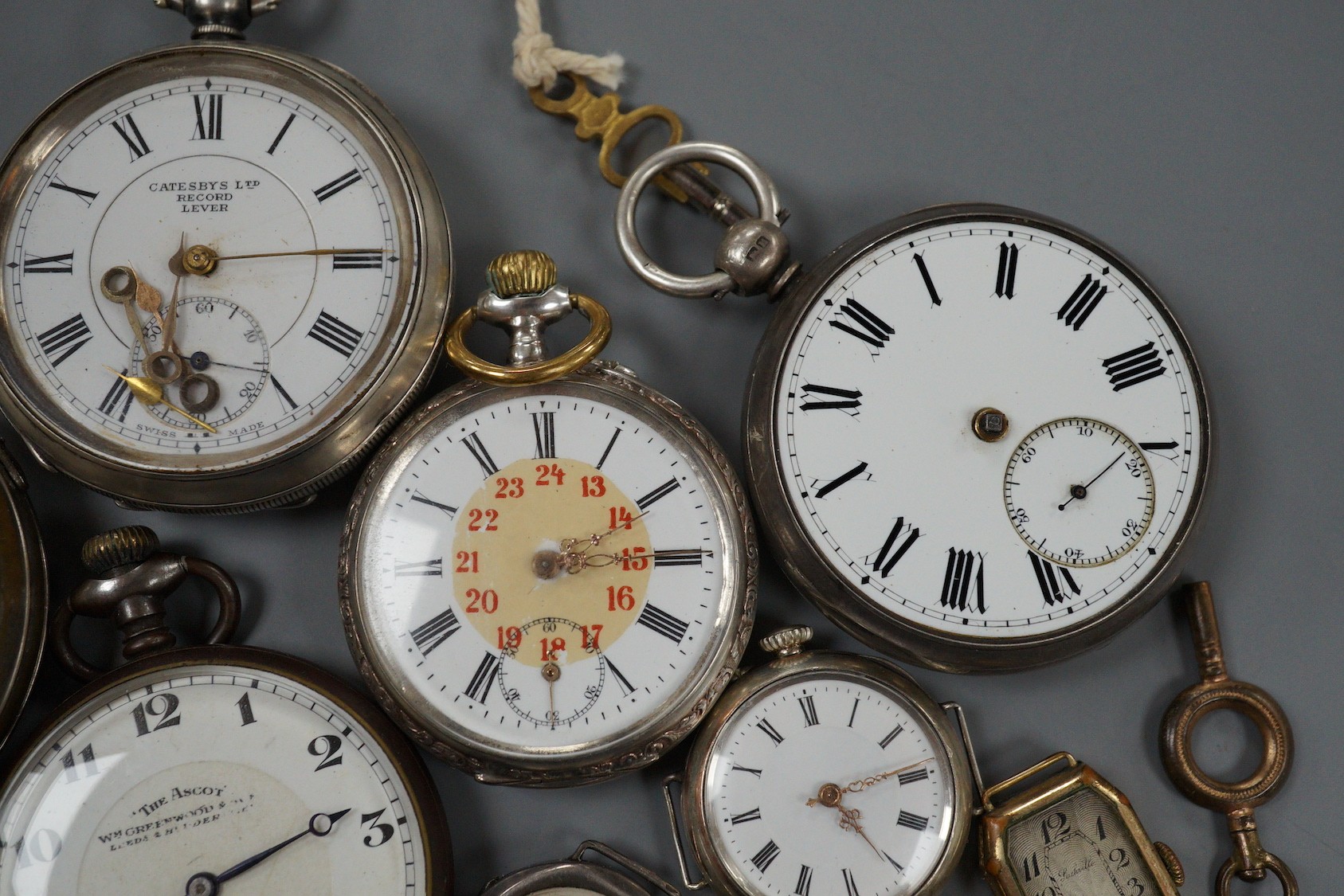 Two silver open faced pocket watches including Catesbys Ltd Record Lever, a German 800 pocket watch, two other base metal pocket watches, four assorted wrist watches and a gilt metal watch bracelet.